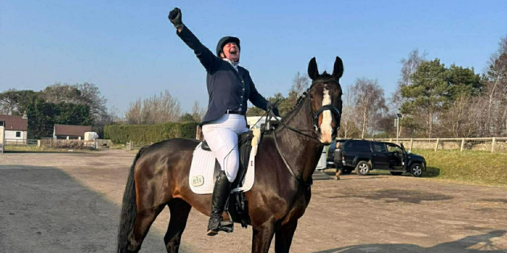 Lucy Barclay Carr celebrating on horse Lily